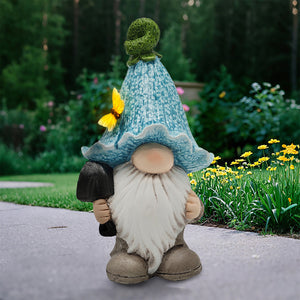 Gnome with Blue Flower Hat and Shovel. Polyresin. 10.3in.