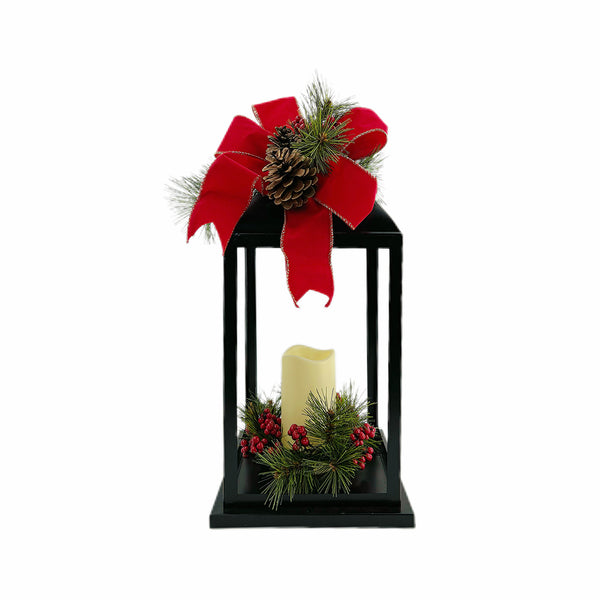 Black Lantern with LED Candle. Red Christmas Bow top and Greenery. 19" high lantern. 6" high LED candle.